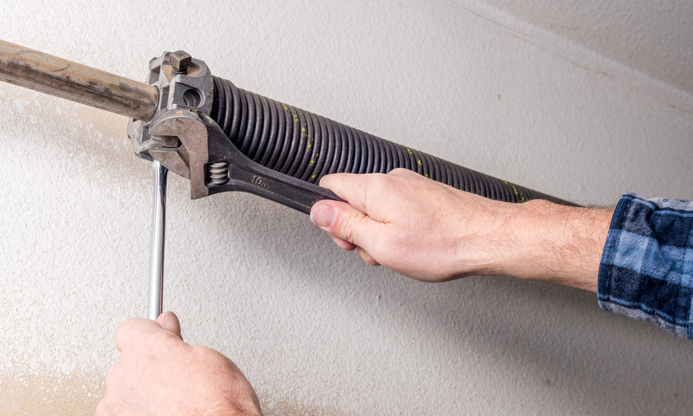 how to loosen garage door spring